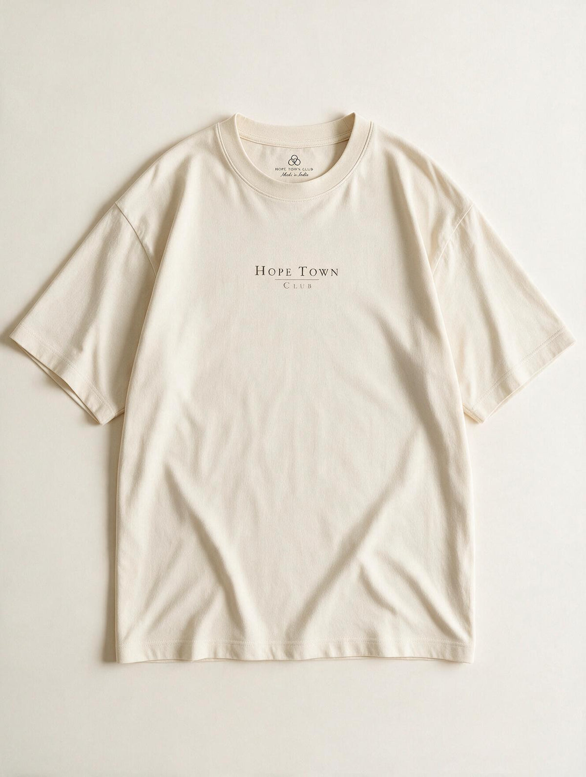 Nothing to Prove Nowhere to Be Off White - Product flat lay with logo and neck label