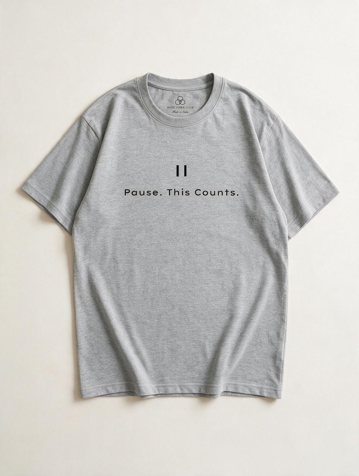 Pause This Counts Grey Melange - Product flat lay with neck label