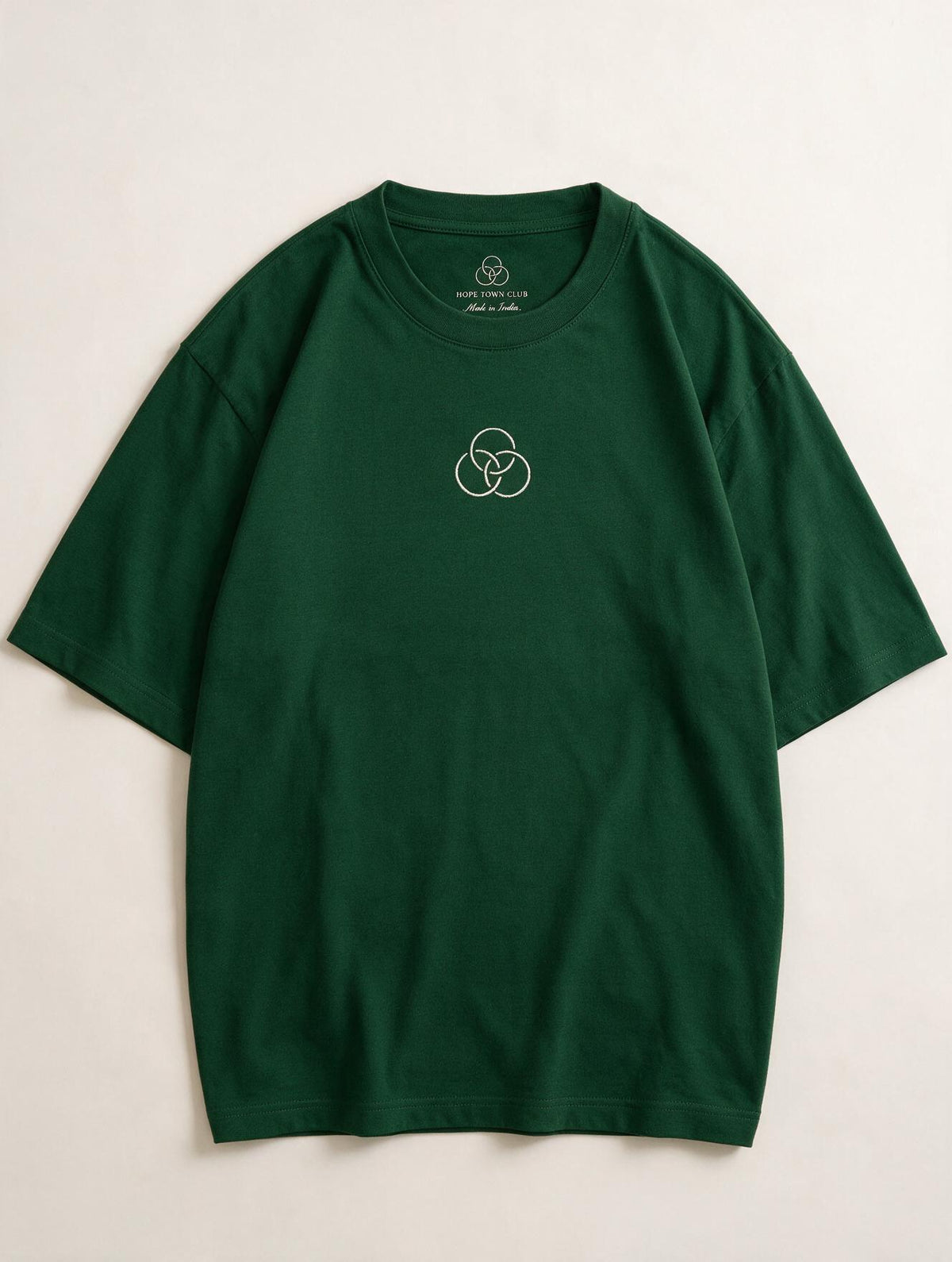 Still Here Bottle Green - Product flat lay with neck label